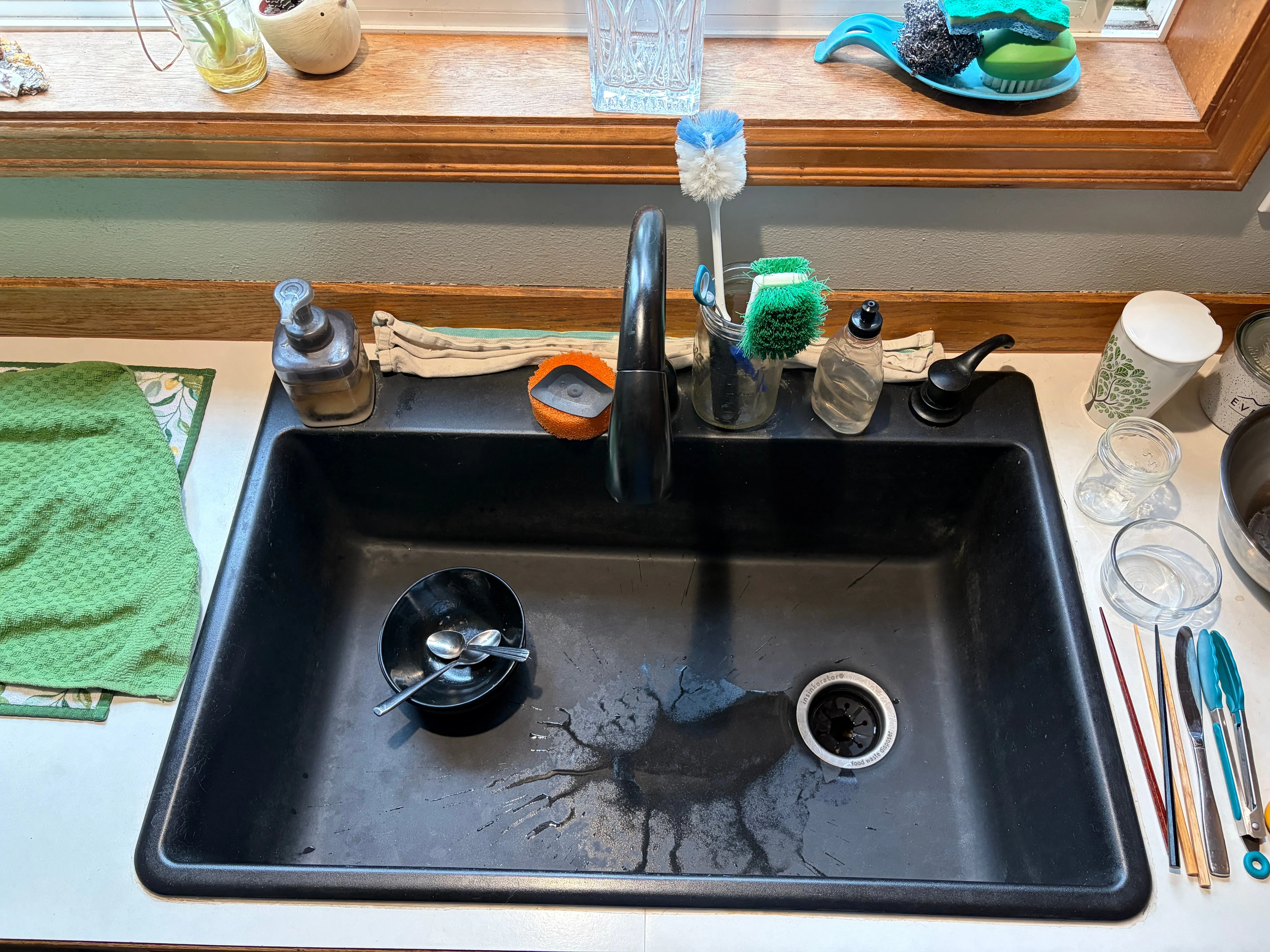 my giant, black kitchen sink with a tasteful amount of dirty dishes