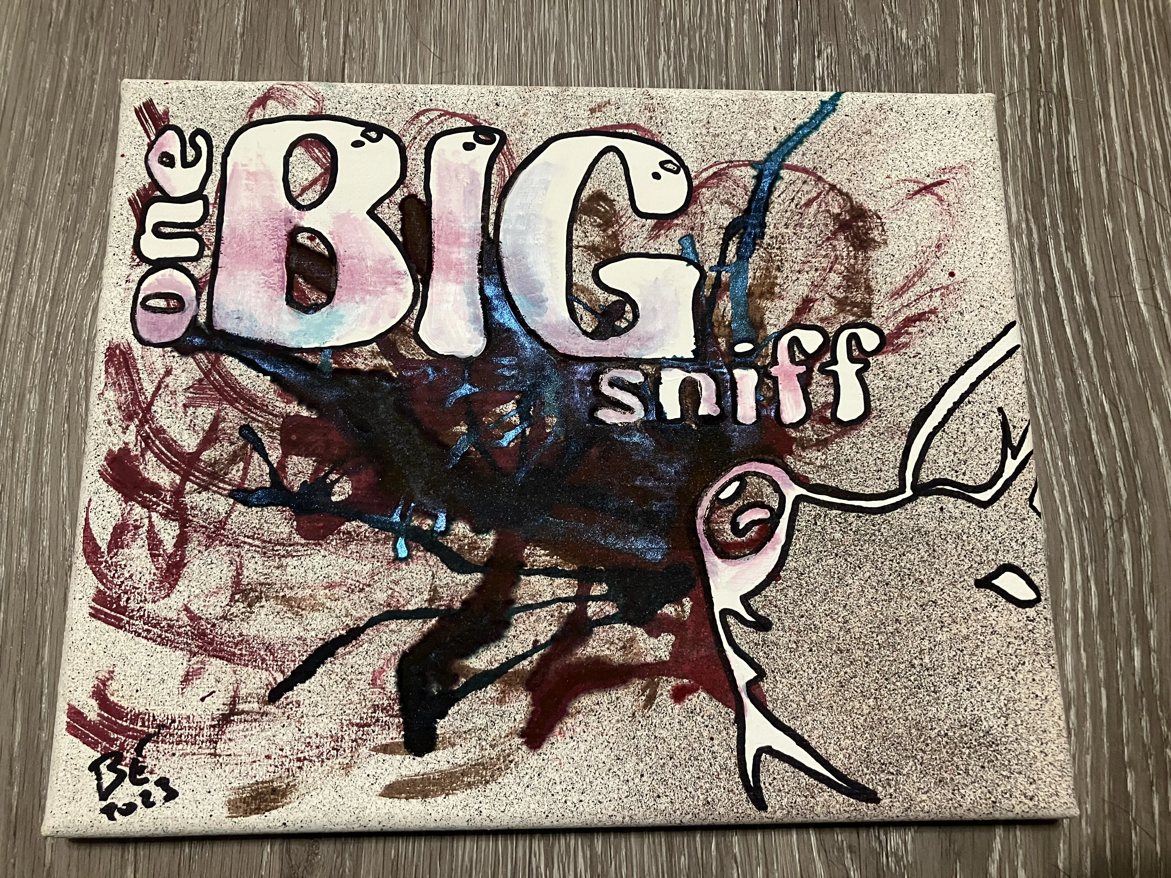 canvas art of a pig sniffing colorful swirls with the text 'One Big Sniff'
